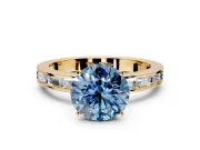 Solitaire Engagement Ring Setting for Fancy Blue Round Cut Center with Channel Baguette Band and Prong Head in Yellow Gold