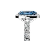 Halo Engagement Ring Setting for Fancy Blue Emerald Cut Center with Full Pave Band and Prong Head in Platinum