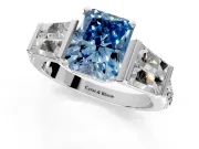 Channel-Set Engagement Ring Setting for Fancy Blue Radiant Cut Center with Baguette Band and Prong Head in Platinum