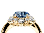 Small-Accent Cluster Halo Engagement Ring Setting for Fancy Blue Round Cut Center with Plain Band and Prong Head in Yellow Gold