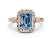Halo Engagement Ring Setting for Fancy Blue Emerald Cut Center with Heart-Shaped Openwork, Pave Band and Prong Head in Rose Gold