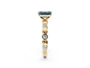 Solitaire Engagement Ring Setting for Fancy Blue Emerald Cut Center with Beaded Bezel Station Band and Prong Head in Yellow Gold