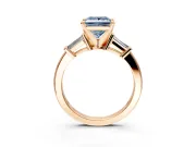 3 Stone Engagement Ring Setting for Fancy Blue Princess Cut Center with Channel Baguette Accents and Prong Head in Rose Gold