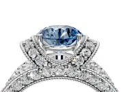 Pave Engagement Ring Setting for Fancy Blue Round Cut Center with Curved Accent Rows, Openwork and Prong Head in White Gold