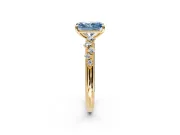 Cluster Engagement Ring Setting for Fancy Blue Radiant Cut Center with Round Cut Accent Band and Prong Head in Yellow Gold