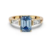 3 Stone Engagement Ring Setting for Fancy Blue Emerald Cut Center with Tapered Baguettes, Plain Band and Prong Head in Yellow Gold