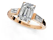 3 Stone Engagement Ring Setting for Emerald Cut Center with Baguette Accents and Prong Head in Rose Gold