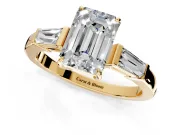 3 Stone Engagement Ring Setting for Emerald Cut Center with Baguette Accents and Prong Head in Yellow Gold