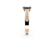 Solitaire Engagement Ring Setting for Fancy Blue Emerald Cut Center with Princess Cut Channel Band and Prong Head in Rose Gold