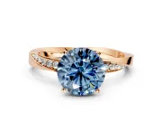 Side Accent Engagement Ring Setting for Fancy Blue Round Cut Center with Accent Shoulders and Prong Head in Rose Gold