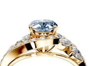 Halo Engagement Ring Setting for Fancy Blue Oval Center with Marquise and Pave Bypass Band and Prong Head in Yellow Gold