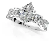 3 Stone Engagement Ring Setting for Pear-Shaped Center with Pave Split Shank and Prong Head in Platinum