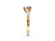 3 Stone Engagement Ring Setting for Fancy Pink Heart-Shaped Center with Tapered Baguettes, Plain Band and Prong Head in Yellow Gold