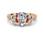 Cluster Engagement Ring Setting for Pear-Shaped Center with Bezel Accent Clusters and Prong Head in Rose Gold