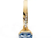 Side Accent Engagement Ring Setting for Fancy Blue Radiant Cut Center with Accent Shoulders and Prong Head in Yellow Gold
