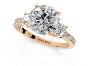 3 Stone Engagement Ring Setting for Round Cut Center with Round Cut Side Accents and Prong Head in Rose Gold