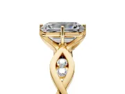 Solitaire Engagement Ring Setting for Emerald Cut Center with Accented Twist Band and Leaf Prong Head in Yellow Gold