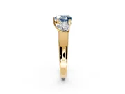 3 Stone Engagement Ring Setting for Fancy Blue Heart-Shaped Center with Raised Basket Heads and Prong Head in Yellow Gold
