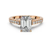 Solitaire Engagement Ring Setting for Emerald Cut Center with Crossover Accents and Prong Head in Rose Gold