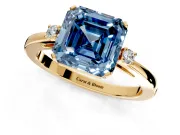 3 Stone Engagement Ring Setting for Fancy Blue Asscher Cut Center with Low-Set Round Cut Accents and Prong Head in Yellow Gold
