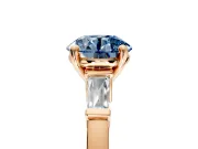 3 Stone Engagement Ring Setting for Fancy Blue Round Cut Center with Channel Baguette Accents and Prong Head in Rose Gold