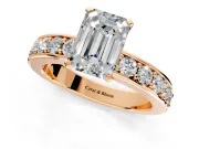 Solitaire Engagement Ring Setting for Emerald Cut Center with Channel-Set Accents and Prong Head in Rose Gold