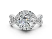 Halo Engagement Ring Setting for Round Cut Center with Pave Infinity Twist Band and Prong Head in Platinum