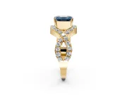 Halo Engagement Ring Setting for Fancy Blue Emerald Cut Center with Pave Infinity Twist Band and Prong Head in Yellow Gold