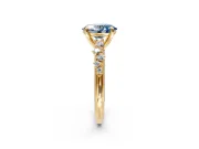 Solitaire Engagement Ring Setting for Fancy Blue Oval Center with Trailing Leaf Accent Band and Prong Head in Yellow Gold