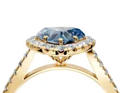 Halo Engagement Ring Setting for Fancy Blue Heart-Shaped Center with Narrowing Pave Band and Prong Head in Yellow Gold