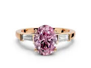 3 Stone Engagement Ring Setting for Fancy Pink Oval Center with Channel Baguette Accents and Prong Head in Rose Gold