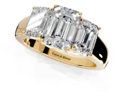 3 Stone Engagement Ring Setting for Emerald Cut Center with Raised Basket Heads and Prong Head in Yellow Gold