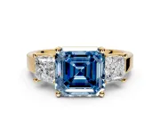 3 Stone Engagement Ring Setting for Fancy Blue Asscher Cut Center with Matching Side Accents and Prong Head in Yellow Gold