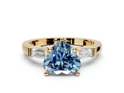 3 Stone Engagement Ring Setting for Fancy Blue Heart-Shaped Center with Channel Baguette Accents and Prong Head in Yellow Gold