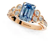 Cluster Engagement Ring Setting for Fancy Blue Emerald Cut Center with Bezel Accent Clusters and Prong Head in Rose Gold