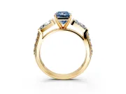 Channel-Set Engagement Ring Setting for Fancy Blue Radiant Cut Center with Baguette Band and Prong Head in Yellow Gold