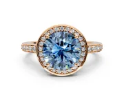 Halo Engagement Ring Setting for Fancy Blue Round Cut Center with Metal-Rimmed Halo, Pave Band and Prong Head in Rose Gold