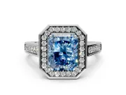 Halo Engagement Ring Setting for Fancy Blue Radiant Cut Center with Outer Bezel Rim, Pave Band and Prong Head in White Gold