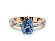 Solitaire Engagement Ring Setting for Fancy Blue Pear-Shaped Center with Channel Baguette Band and Prong Head in Rose Gold