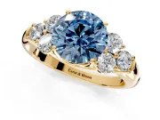 Cluster Engagement Ring Setting for Fancy Blue Round Cut Center with Round Cut Accent Frame and Prong Head in Yellow Gold