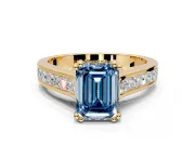 Solitaire Engagement Ring Setting for Fancy Blue Emerald Cut Center with Channel Band and Double Claw Prong Head in Yellow Gold