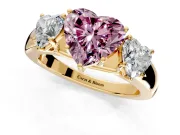 3 Stone Engagement Ring Setting for Fancy Pink Heart-Shaped Center with Raised Basket Heads and Prong Head in Yellow Gold