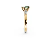 3 Stone Engagement Ring Setting for Fancy Green Heart-Shaped Center with Channel Baguette Accents and Prong Head in Yellow Gold