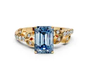 Leaf Motif Engagement Ring Setting for Fancy Blue Emerald Cut Center with Pave Band and Prong Head in Yellow Gold