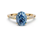 Solitaire Engagement Ring Setting for Fancy Blue Oval Center with Channel Accents and Prong Head in Yellow Gold