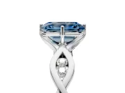 Solitaire Engagement Ring Setting for Fancy Blue Emerald Cut Center with Accented Twist Band and Leaf Prong Head in Platinum