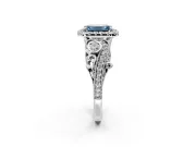 Milgrain Halo Engagement Ring Setting for Fancy Blue Emerald Cut Center with Shoulder Bezels and Prong Head in Platinum