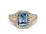 Halo Engagement Ring Setting for Fancy Blue Emerald Cut Center with Narrow Pave Split Shank and Prong Head in Yellow Gold