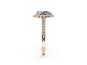 Halo Engagement Ring Setting for Fancy Blue Pear-Shaped Center with Narrowing Pave Band and Prong Head in Rose Gold