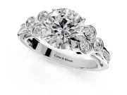 Cluster Engagement Ring Setting for Round Cut Center with Bezel Accent Clusters and Prong Head in Platinum